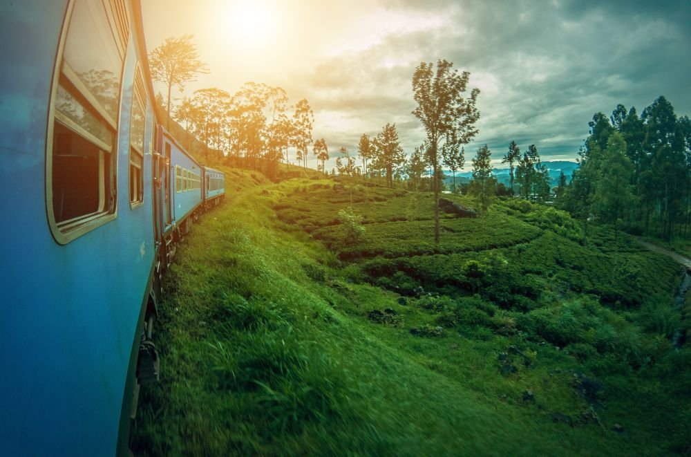 Blue train in Sri Lanka with a sunset